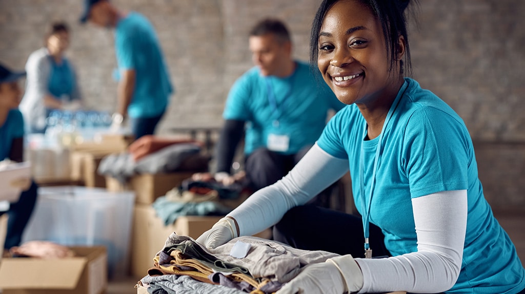 Team of volunteers working at a clothing drive.